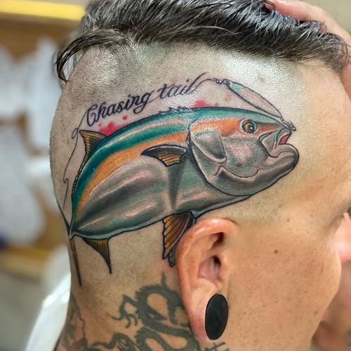 Colorful yellowtail fish skull tattoo