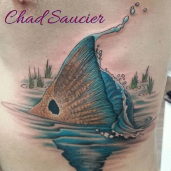 Realistic redfish tail tattoo swirling