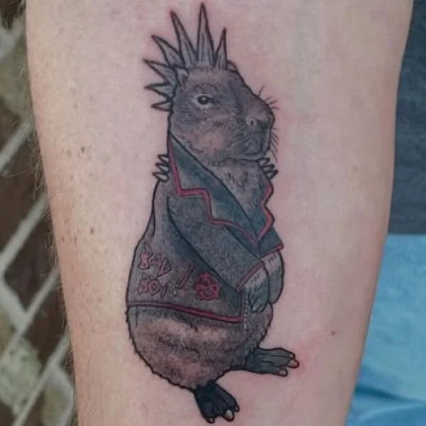 black and white capybara tattoo with a mohawk