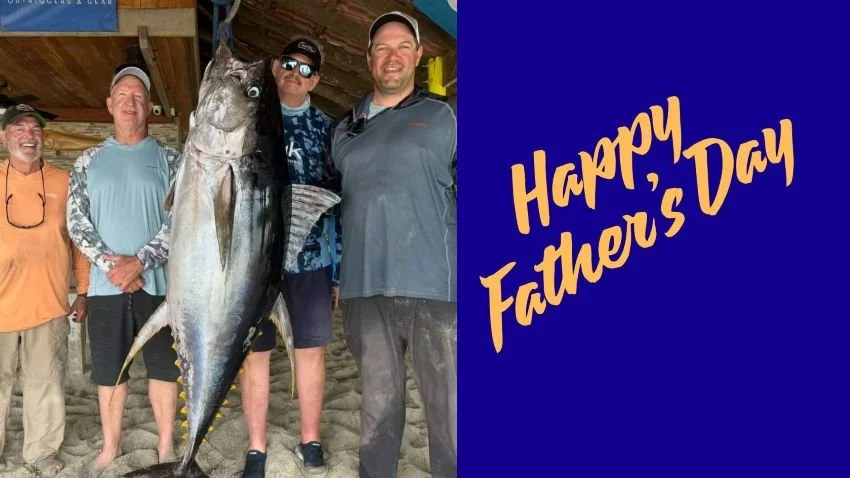 trophy tuna hoisted on a scale