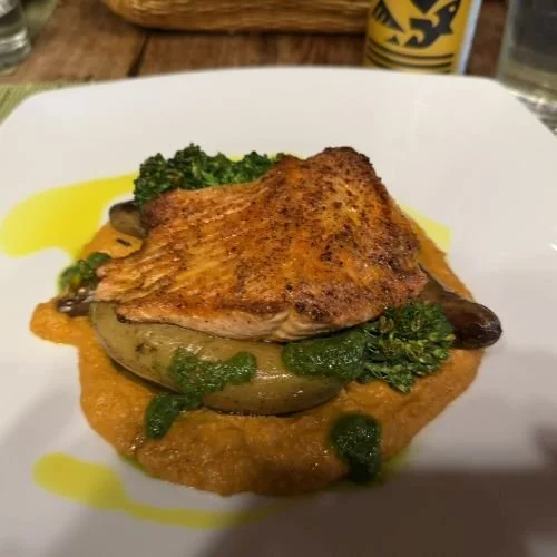 Seared Alaskan salmon with roasted pepper hummus