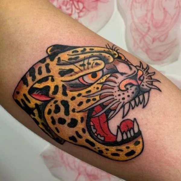 full color growling jaguar tattoo with teeth