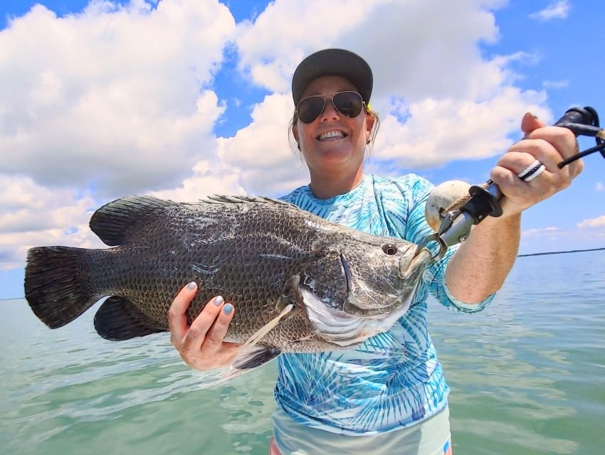 Hanna Robbins with a keeper tripletail caught on a live shrimp