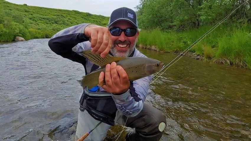 Pete Robbins with grayling Gertrude Creek Bristol Bay Alaska