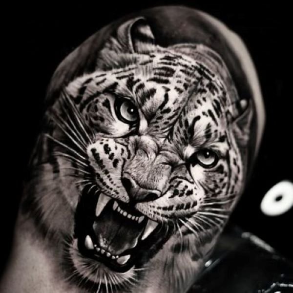 ultra-realistic jaguar tattoo roaring