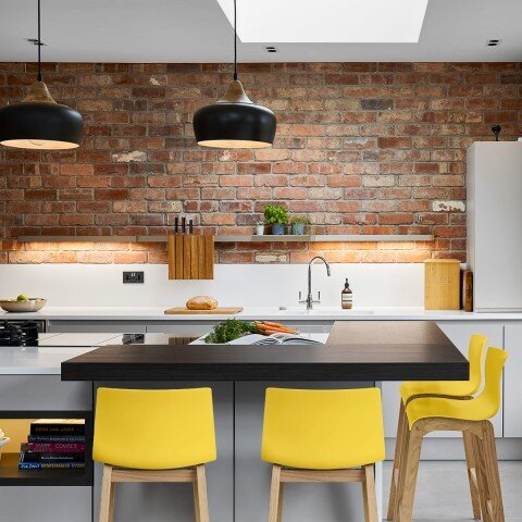 drift-oak-and-yellow-bar-stool-in-open-brick-kitchen.jpg