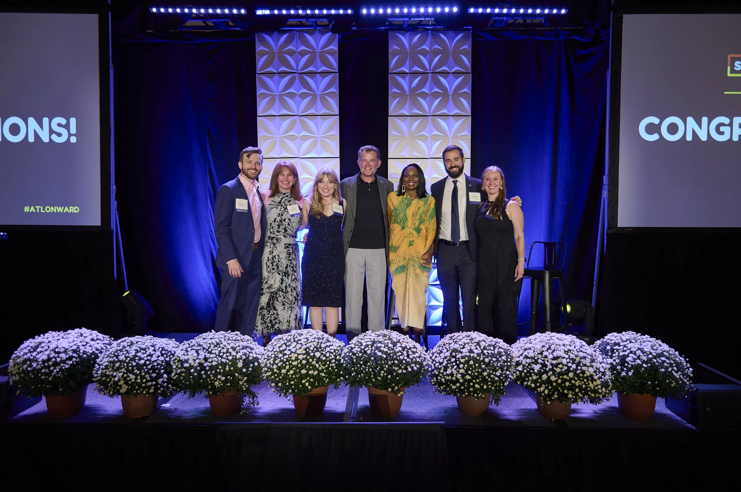 Atlanta Corporate Awards Ceremony and Recognition Event Photography
Award recipients and company leaders pose together onstage during a professionally photographed corporate recognition event in Metro Atlanta.