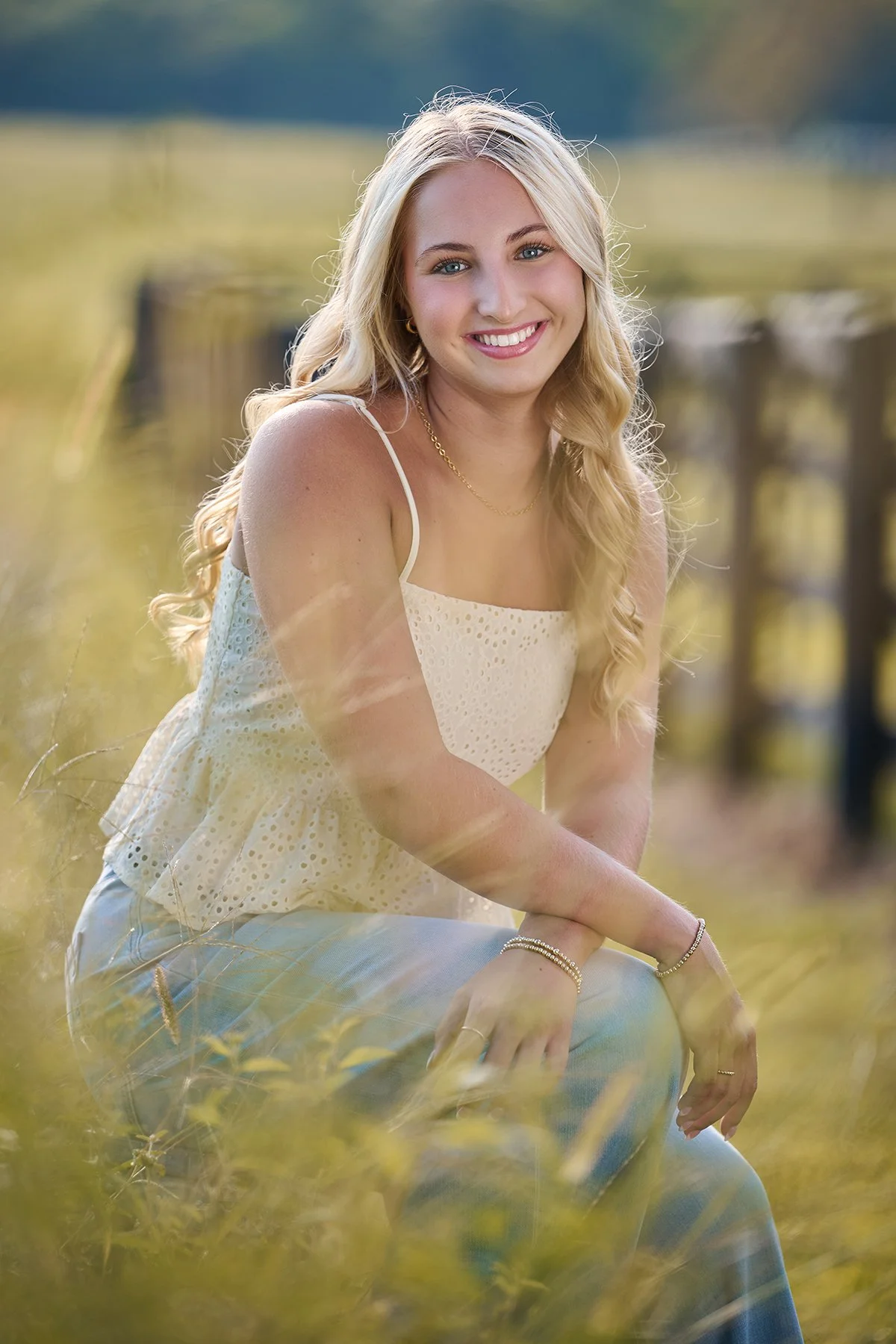 Peachtree City Senior Girl Outdoor Portrait | South Atlanta Photography
Senior girl in a cream summer dress seated outdoors in warm natural light during a senior portrait session in Peachtree City, Georgia.