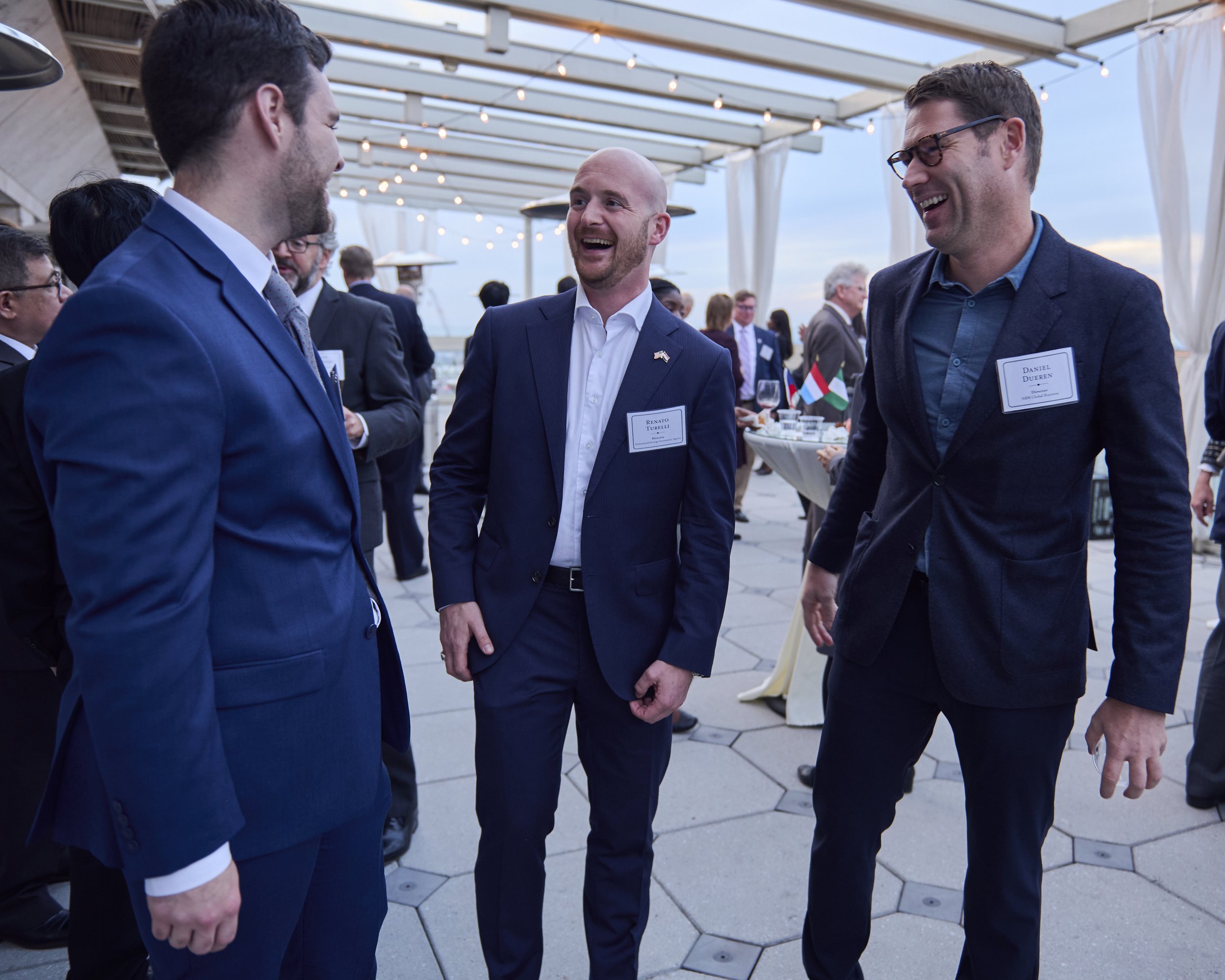 Atlanta Corporate Networking Event and Business Reception Photography
Business professionals laugh and connect during an outdoor corporate networking reception photographed on a rooftop in Atlanta