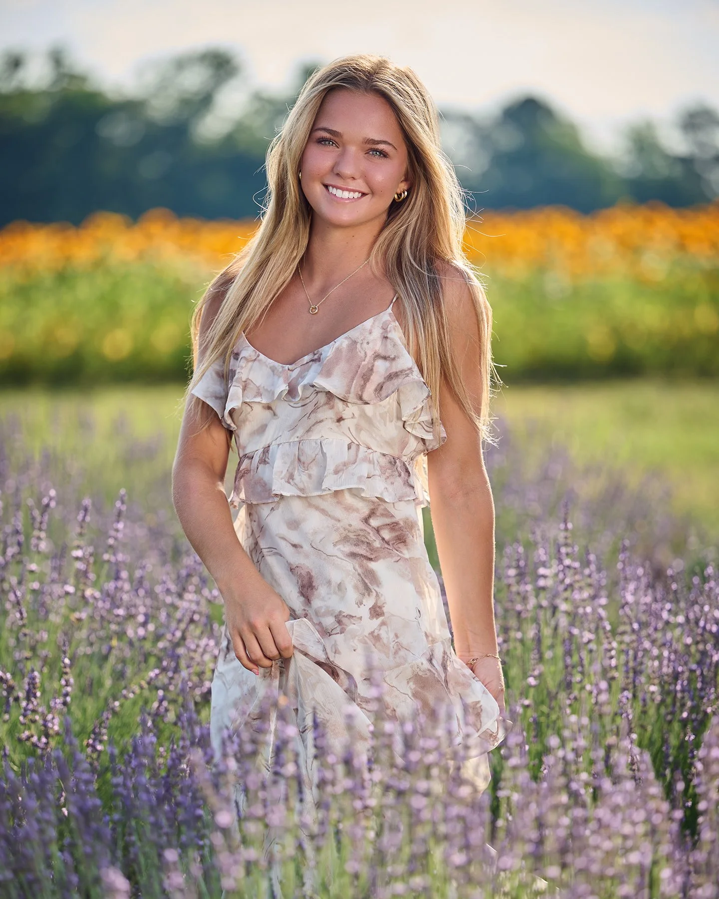 Timeless Class of 2027 senior portrait of a girl in a flower field, photographed by South Atlanta Photography for senior sessions in Fayette County and metro Atlanta.