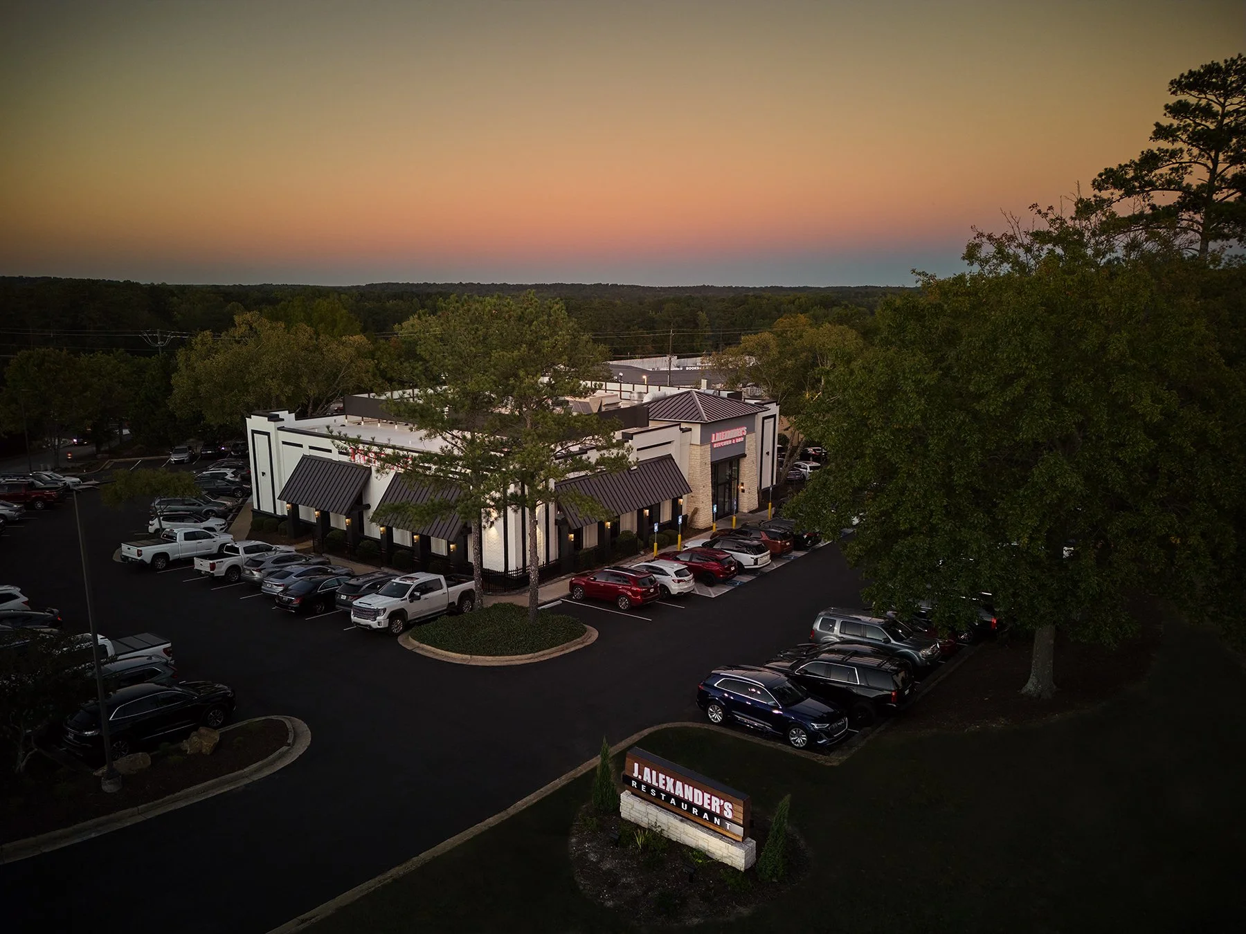 Sunset aerial photography of J. Alexander's commercial investment property and surrounding landscape in Peachtree City, Georgia, by South Atlanta Photography.