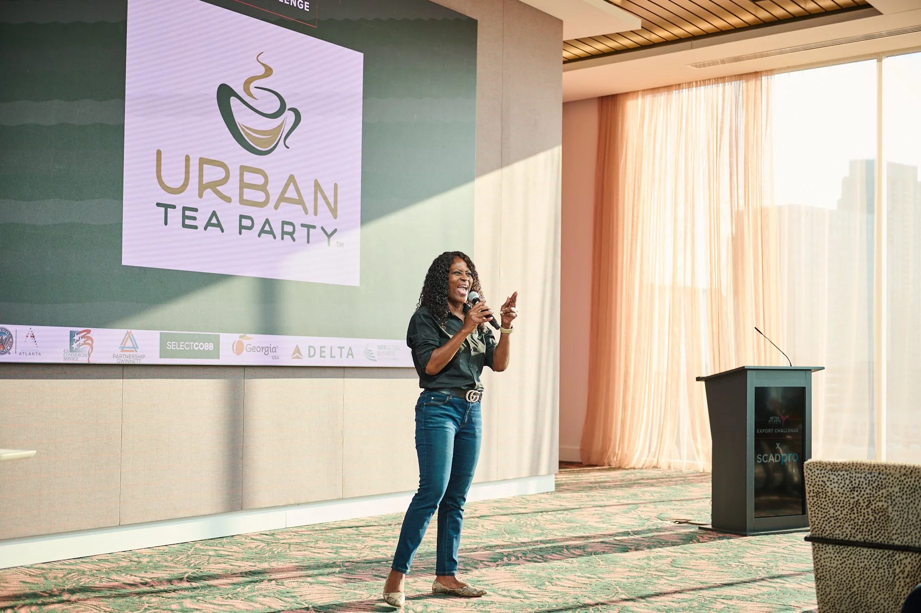 Speaker presenting on stage during the Metro Atlanta Export Challenge in Atlanta, photographed during professional corporate event coverage.