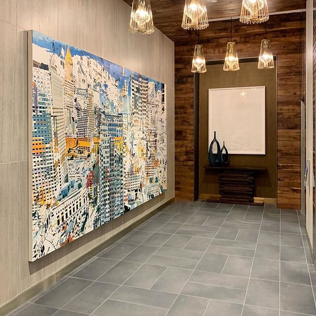 Elevator lobby featuring a commissioned Boston cityscape and an elegant hand-cut paper piece. DM for artists! #BAinstall #artforallsettings