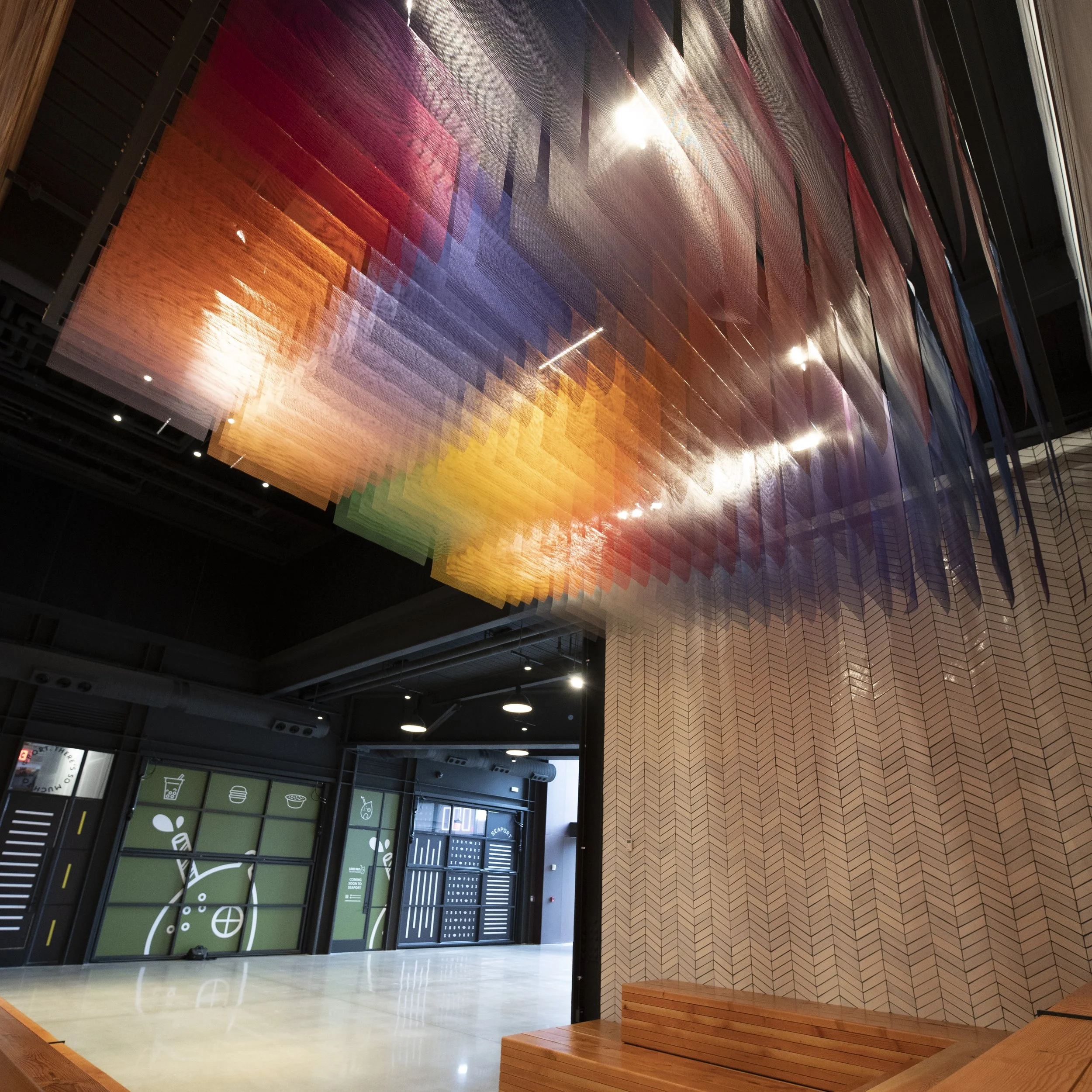 Layered mesh ceiling installation by artist Tomislav Topic displayed in the Boston Amazon headquarters.