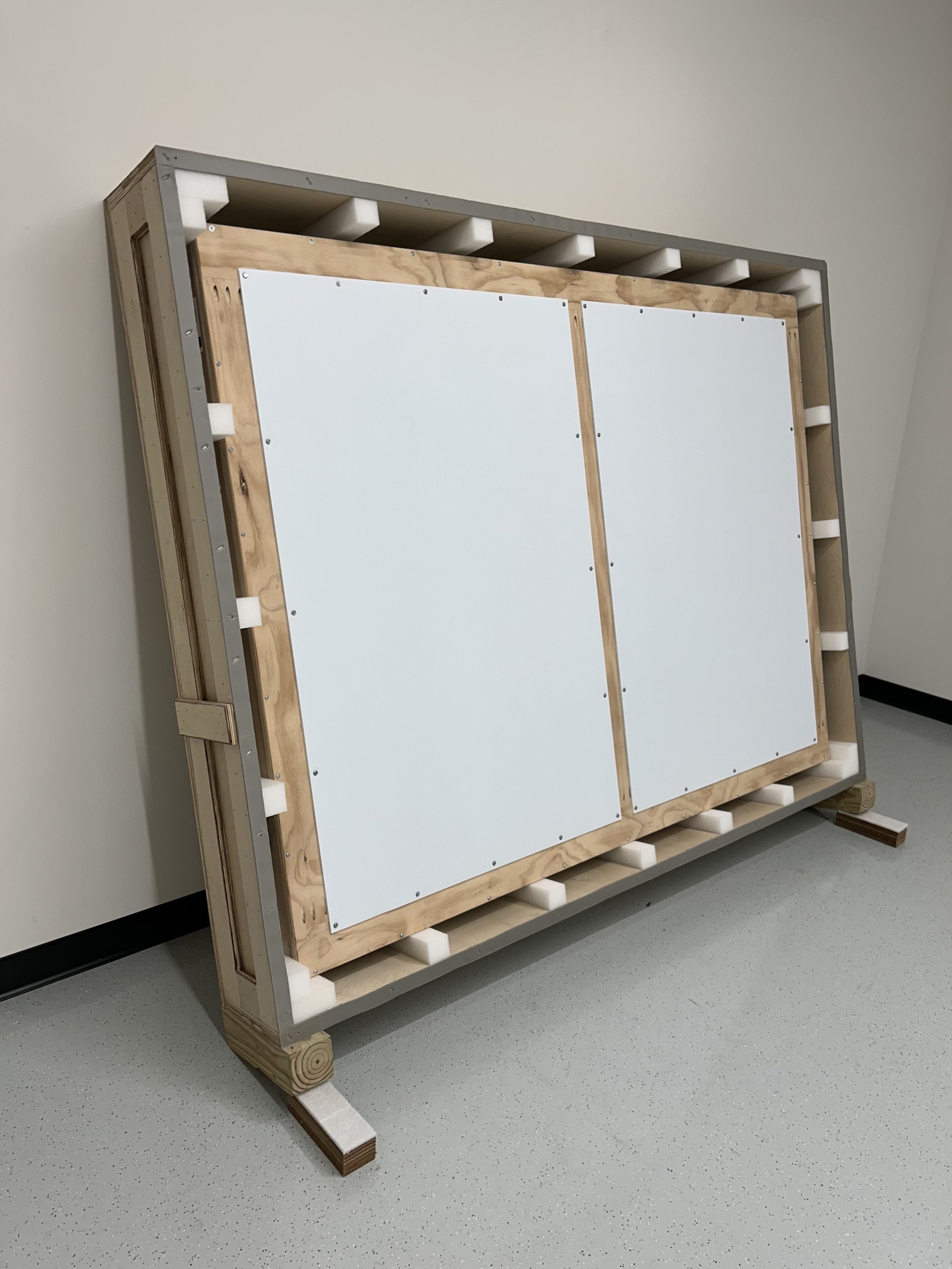 Custom built crate for fine art with opened face, showcasing how the custom handler frame was precisely packed inside