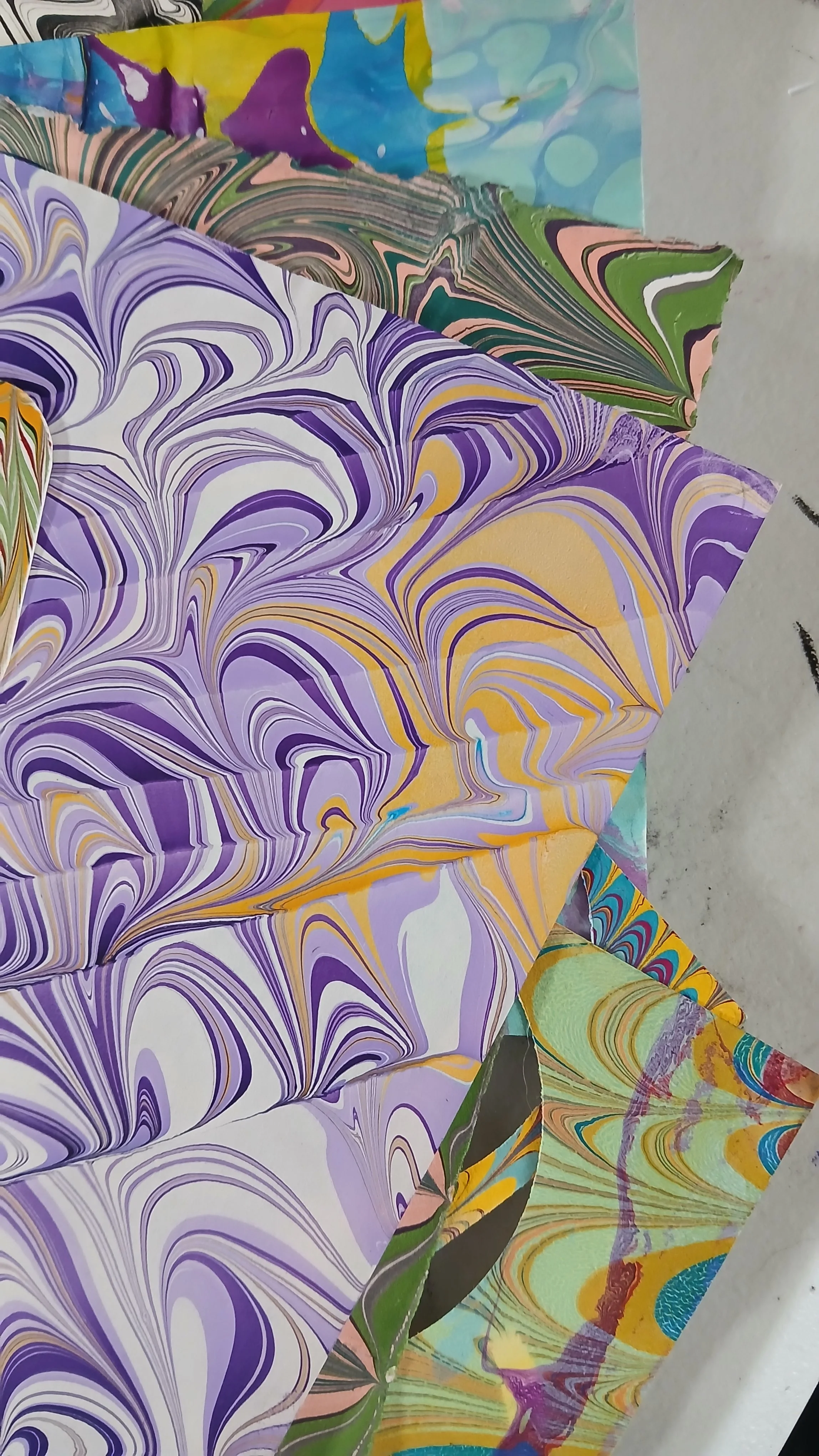 Selecting pieces of paper to turn into earrings