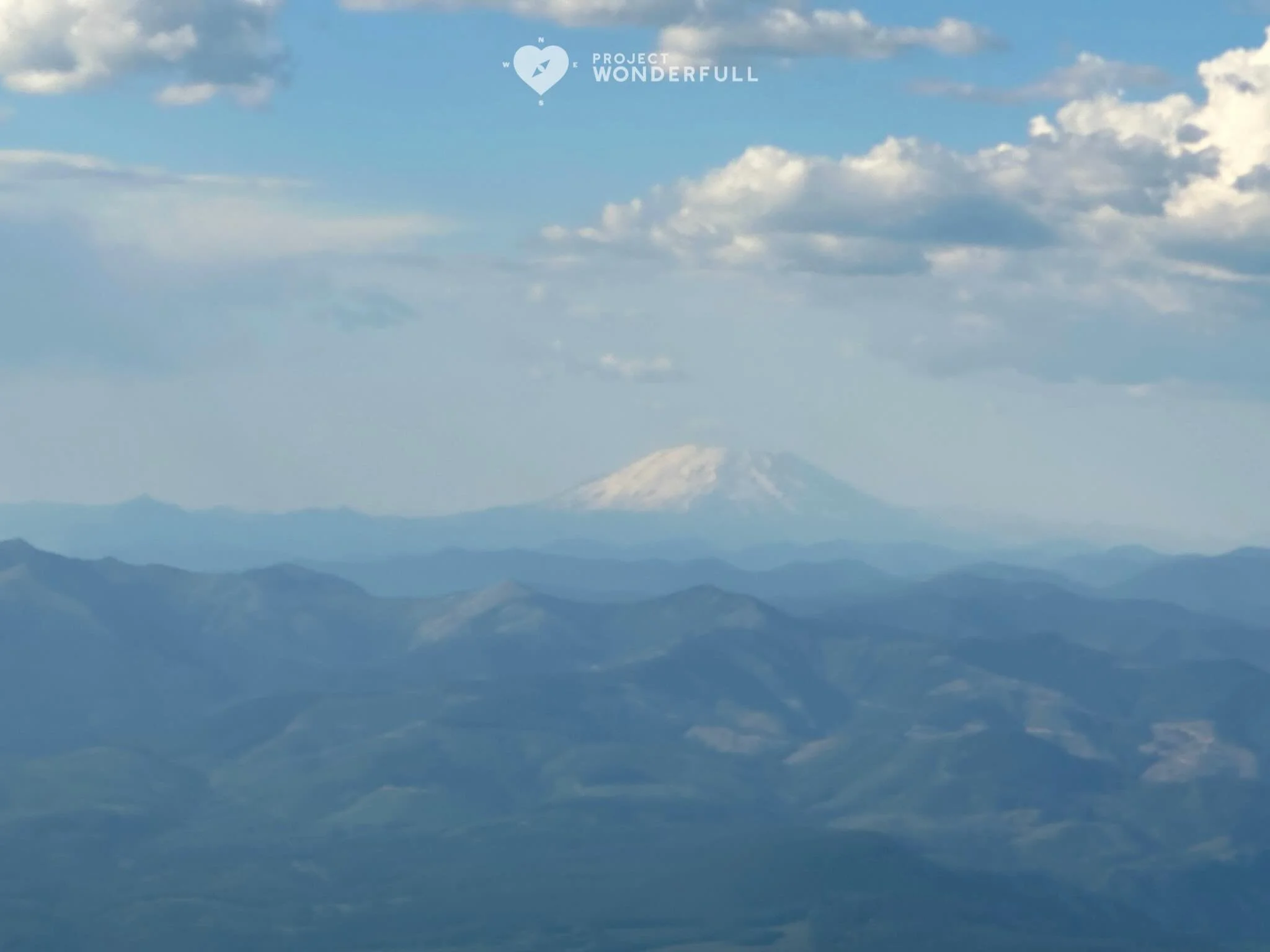 Do you see that faint beauty in the distance? Mt Hood. Grateful for the clear day in the sky!
#beautyheals 

Today&rsquo;s WonderFULL:  Painting from the Sky

(In the air, OR) 

Have a wonderFULL Wednesday! 

Sarah Grace 🩵🩵 

P.S. Share this beauty