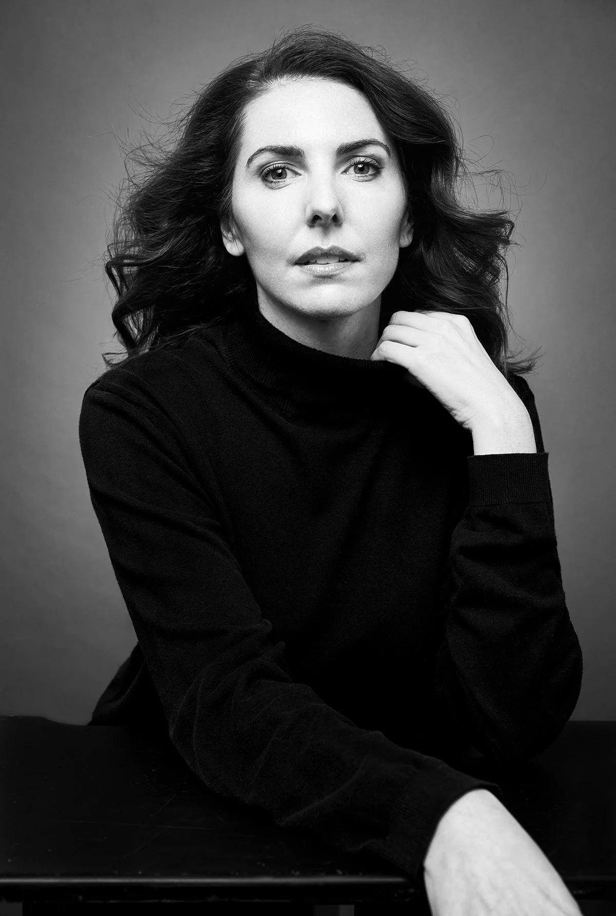 Black and white editorial portrait in a Los Angeles studio showing authentic presence.