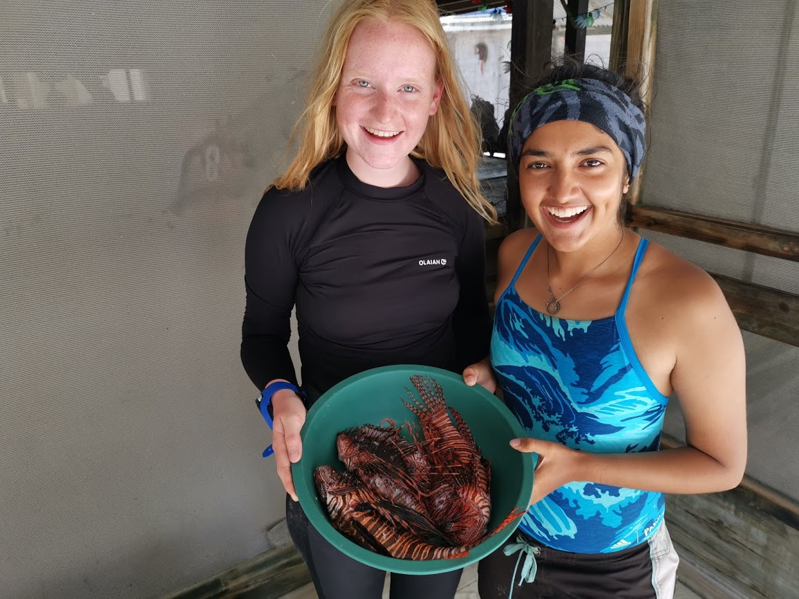 Figure 5: Fellow volunteer Jemima and I with our lionfish catch for the day.