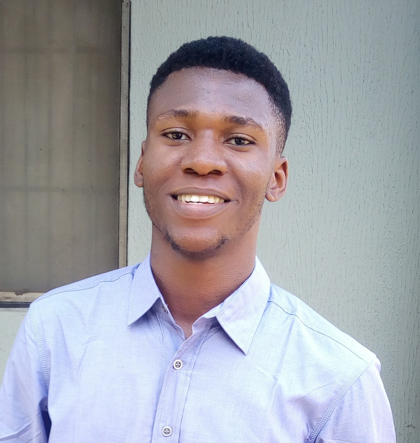Headshot of Chibueze Godwin Onukelobi who is smiling