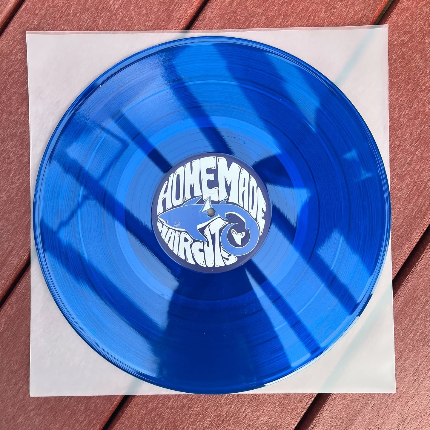 our most recent EP &ldquo;Homemade Haircuts Goes Swimming&rdquo; now available on translucent blue 12&rdquo; vinyl 🌊🦈 pressed in Athens-GA by @weareechobase 

selling these at our upcoming shows, online on our bandcamp page, and at some local SC re