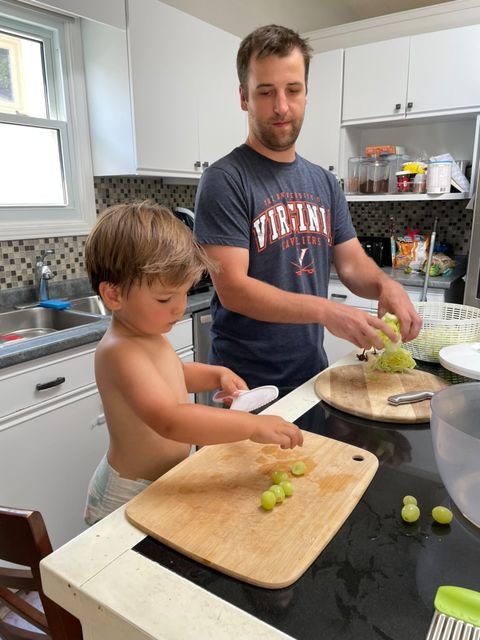 daynaaaj_boy_unknown-age_helping-t0-cook-in-the-kitchen_cutting-grapes.jpeg