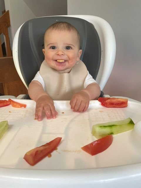 daynaaaj_boy_8mos_eating-vegetables_cucumer-tomato_happy-smiling-baby.jpeg