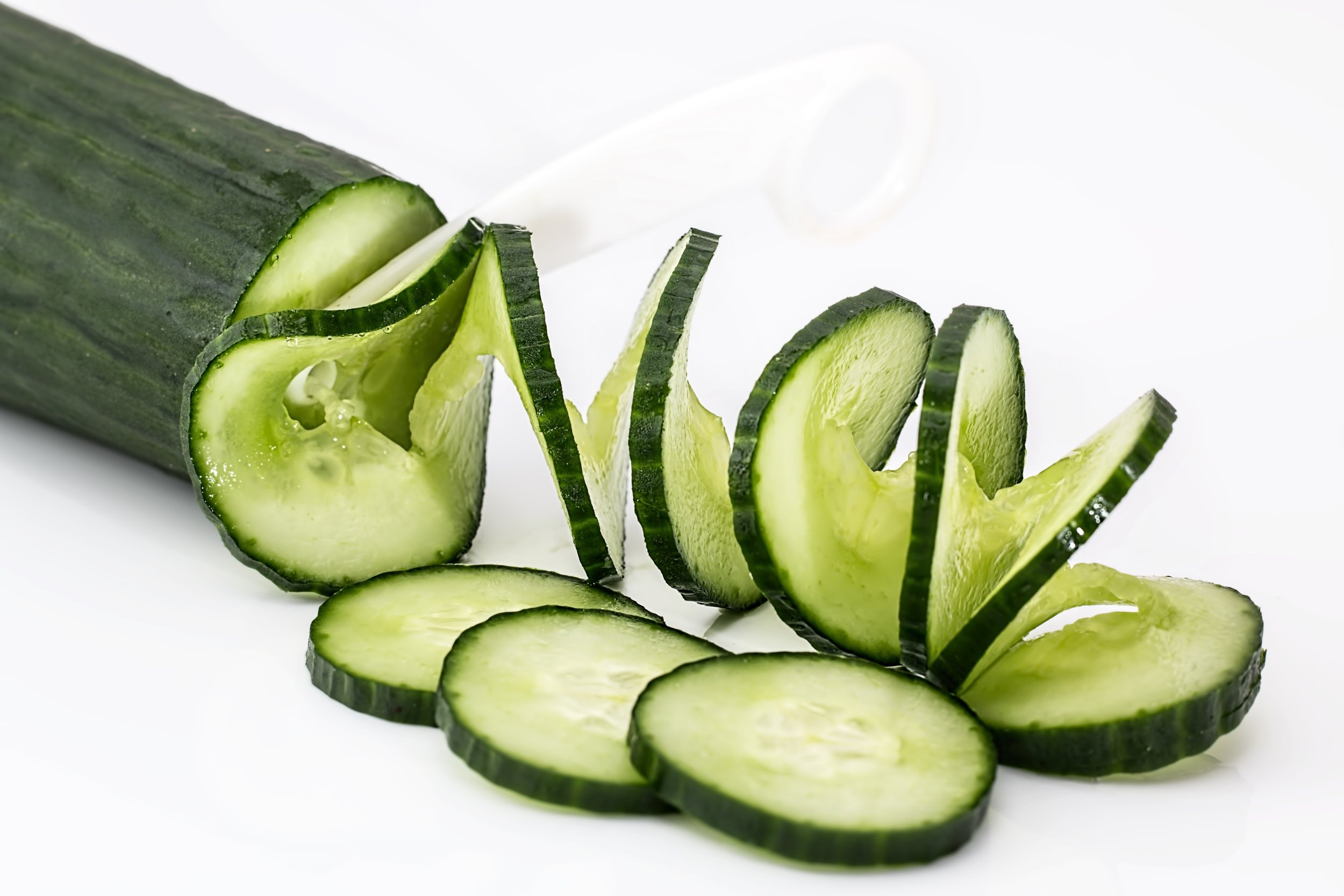 Sliced Cucumber on White Table.jpg