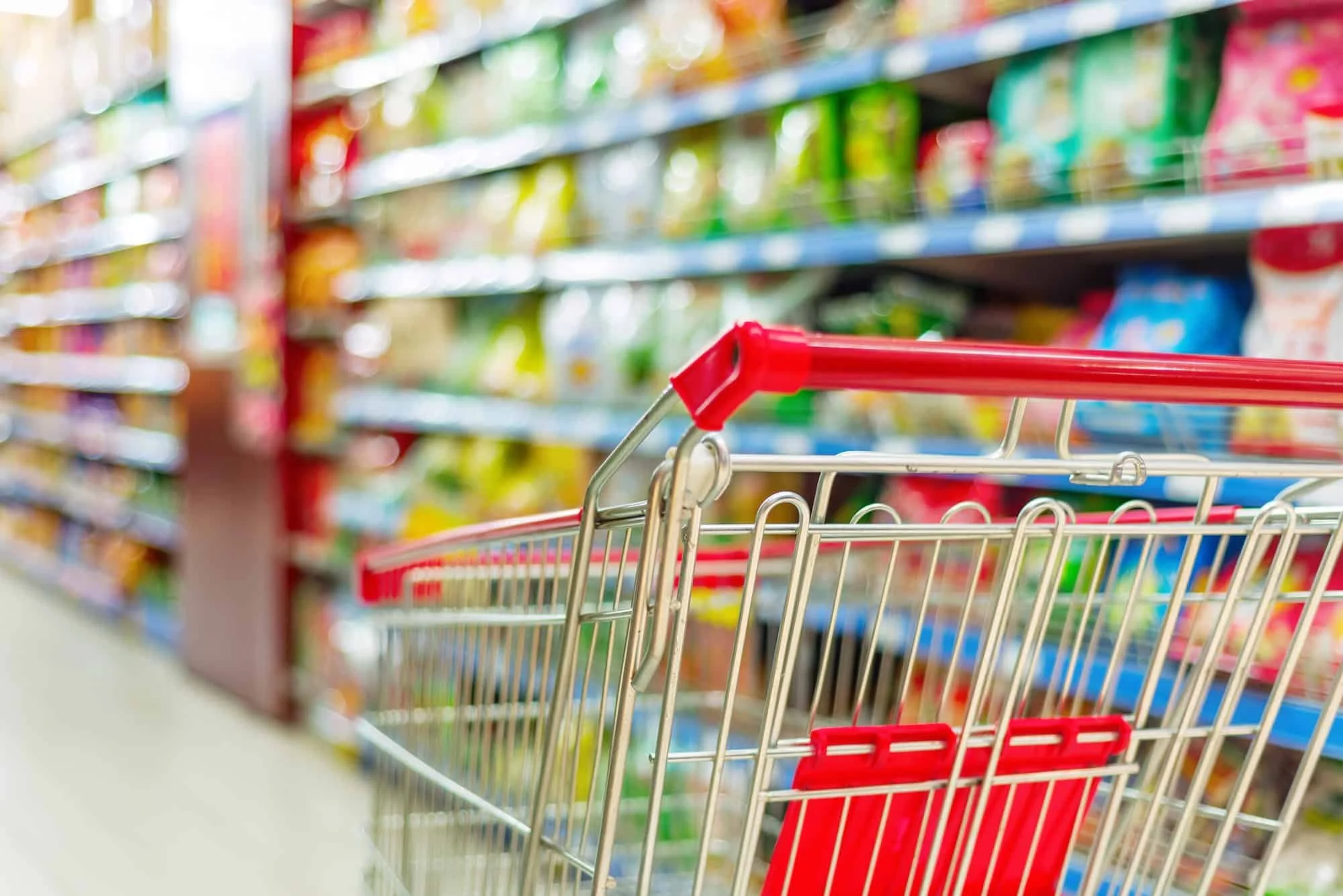 Shopping Cart in Grocery Store Aisle