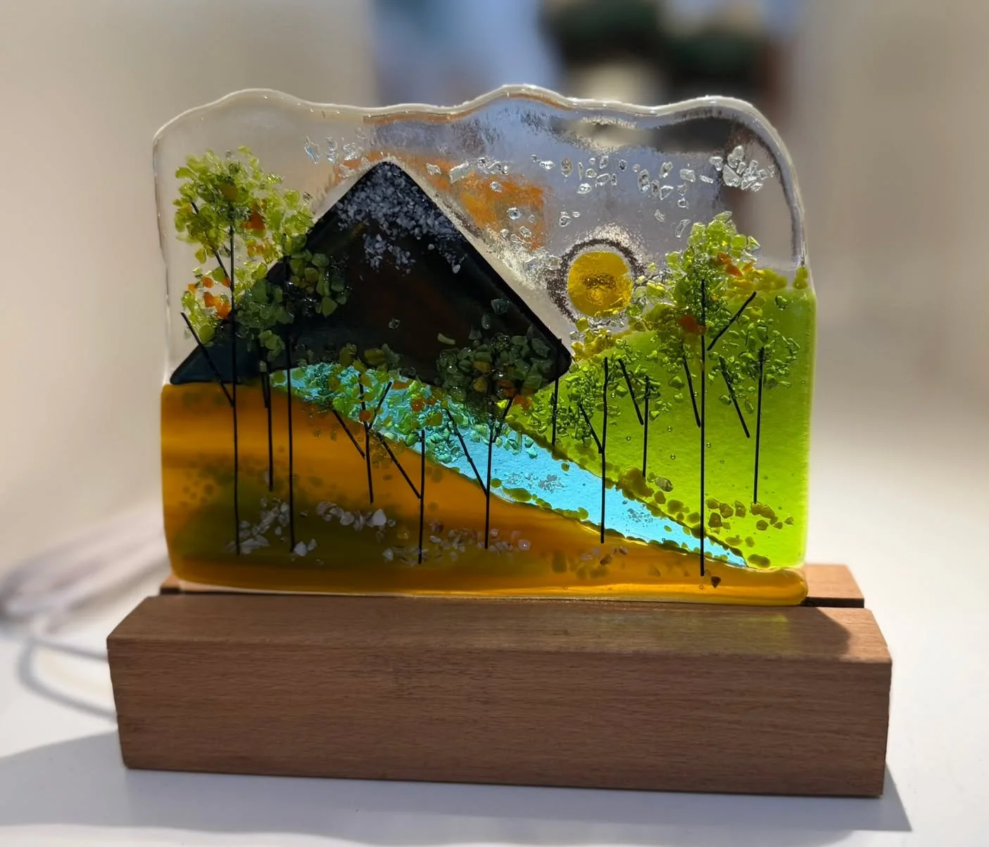 👀Look at this!  Our glass artist, Lisa Marshall, has painted a landscape on a tabletop lamp!  She is clever and gifted!  Come in today and check this out!  It is a great high school graduation gift.  Perfect for a dorm room!

Open Every Day 10-5pm. 