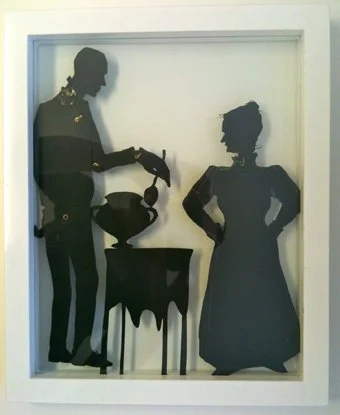 papercut jointed silhouettes of butler and housekeeper