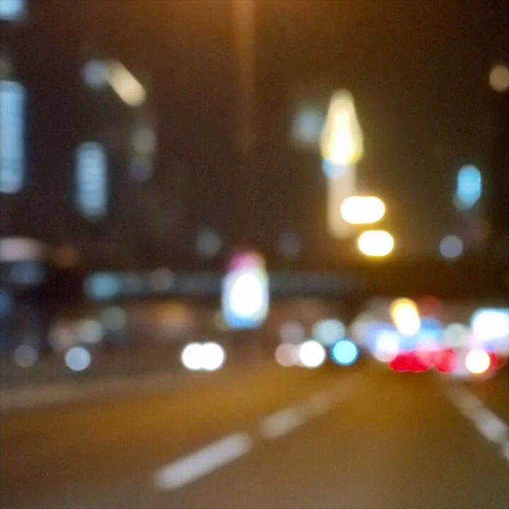 Blurred city street at night with bokeh lights