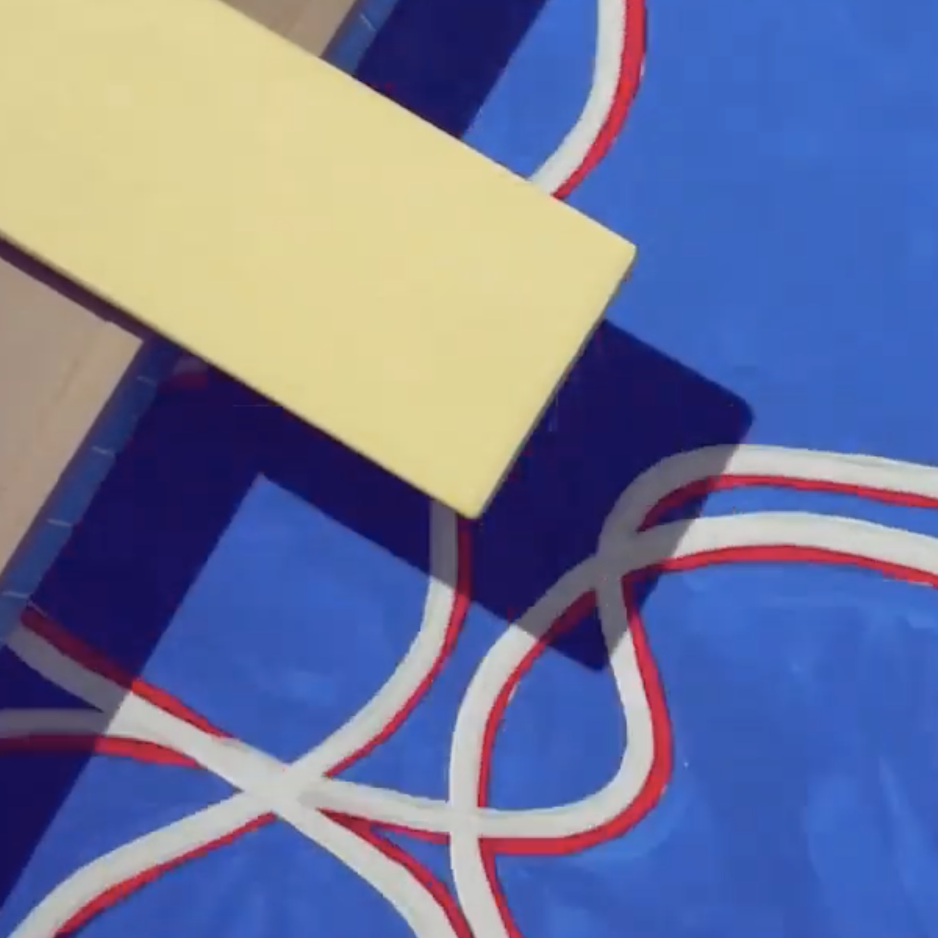 Close-up of a tennis court with yellow net post