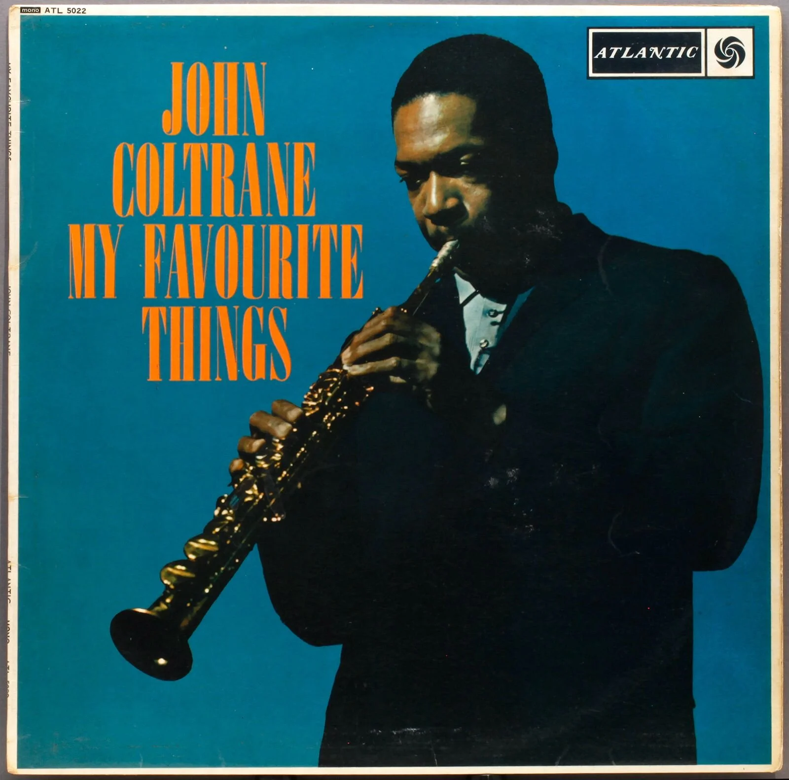 Album cover of 'My Favourite Things' by John Coltrane, featuring Coltrane playing a saxophone against a blue background with orange text.