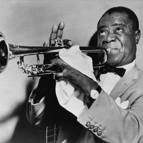 Man playing trumpet in black and white photo