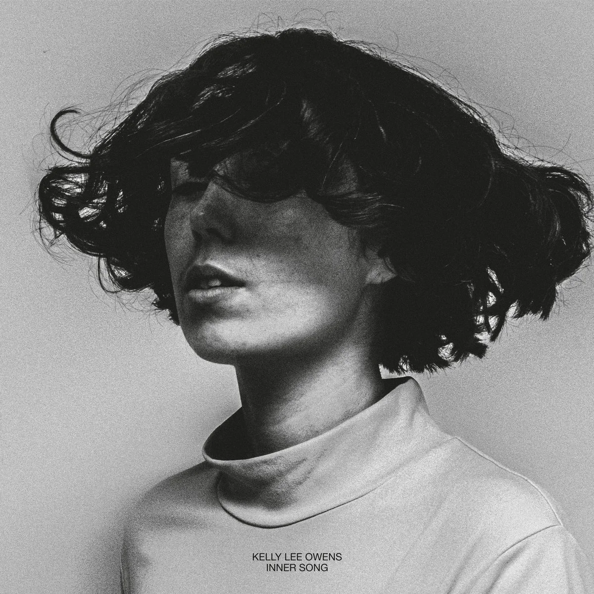 Black and white portrait of a person with a bob haircut looking sideways. The text reads "Kelly Lee Owens Inner Song."