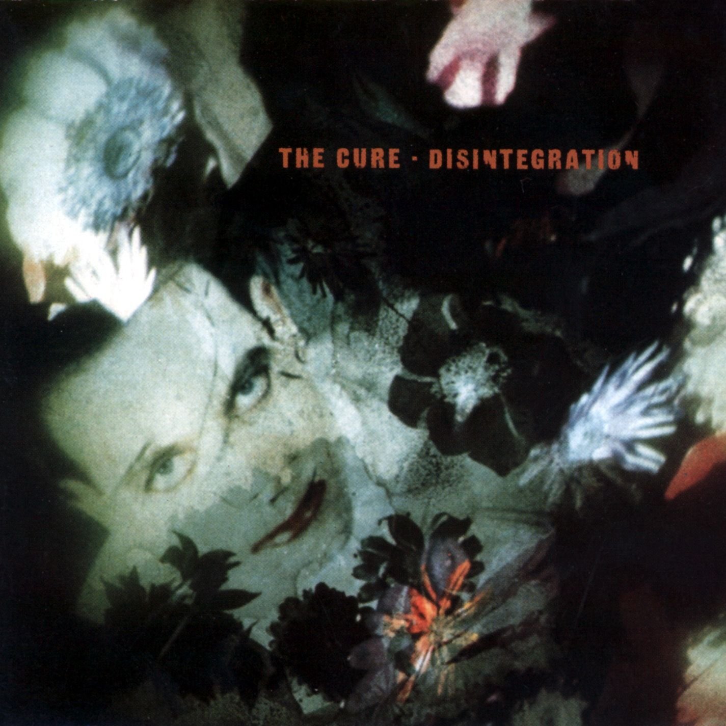 Album cover of "Disintegration" by The Cure featuring a face and abstract floral imagery.