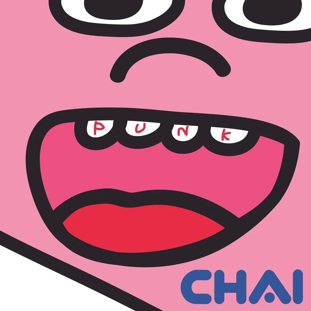 Colorful cartoon face with a wide open mouth showing teeth that spell 'PUNK,' with the word 'CHAI' in bold letters.