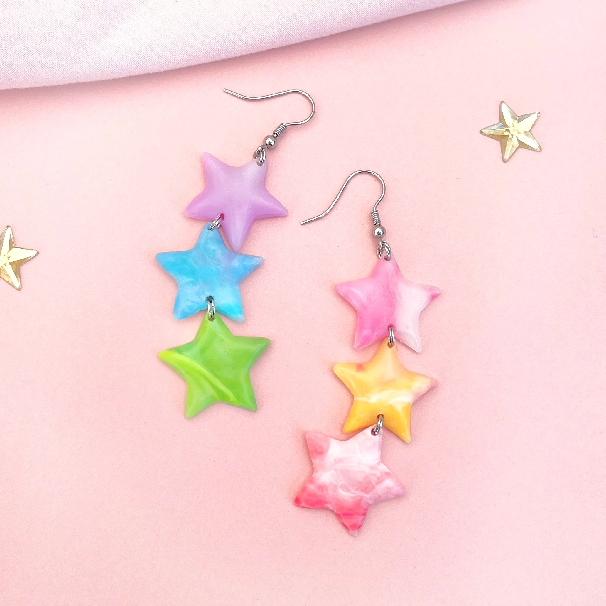 Multicoloured recycled plastic star shaped earrings.