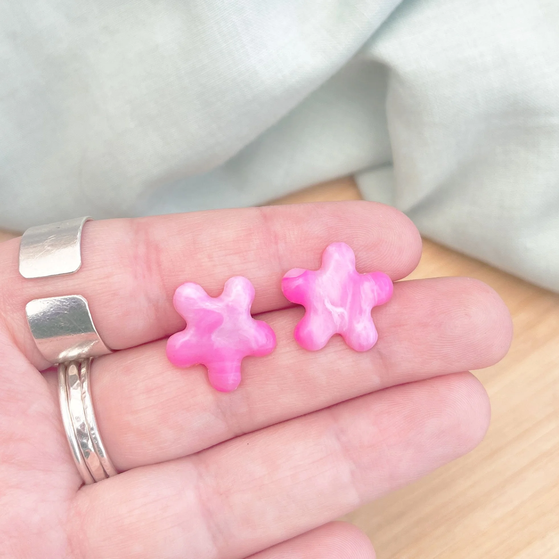 pink squiggle studs.jpg