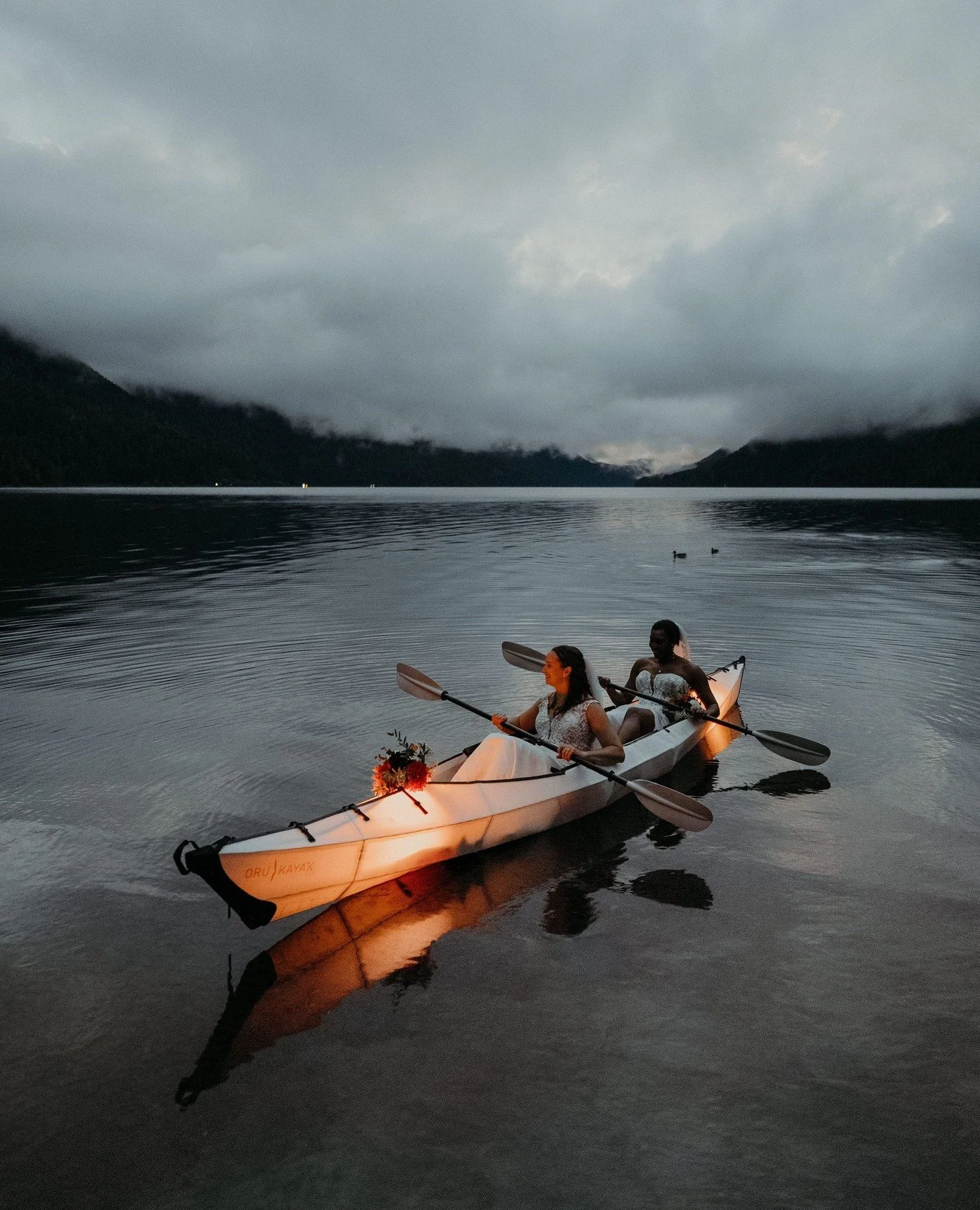 Believe it or not &mdash; these pictures weren't planned. We were rained out of our paddling adventure earlier in the day, but in this clear blue-hour moment after their elopement ceremony, I was like... why not now?!⁠
⁠
...And we were only twenty mi