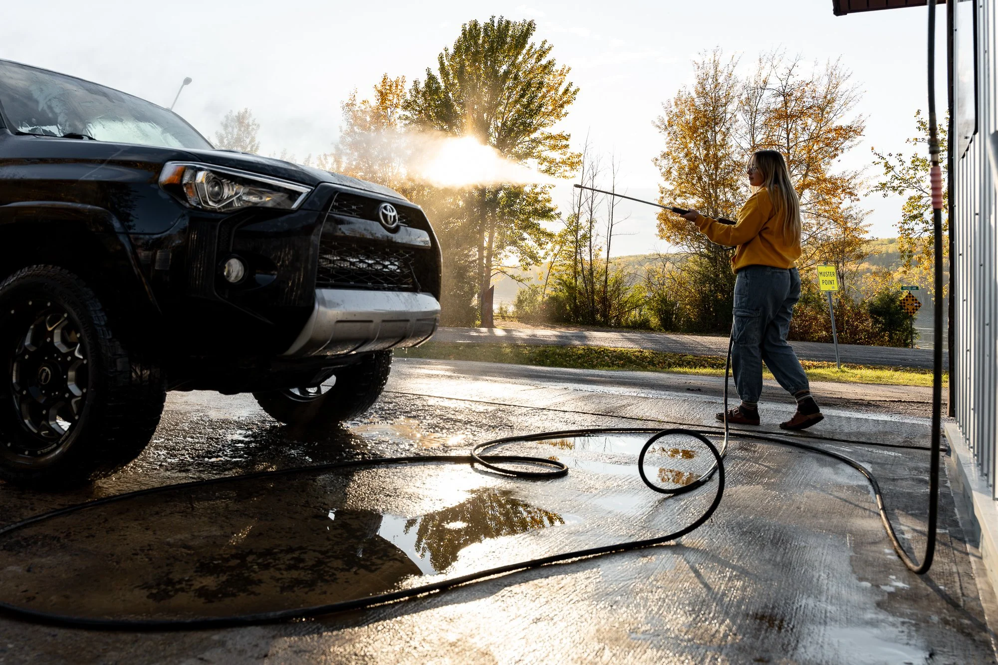 NWT-Fort-Liard-woman-washing-car-11.jpg