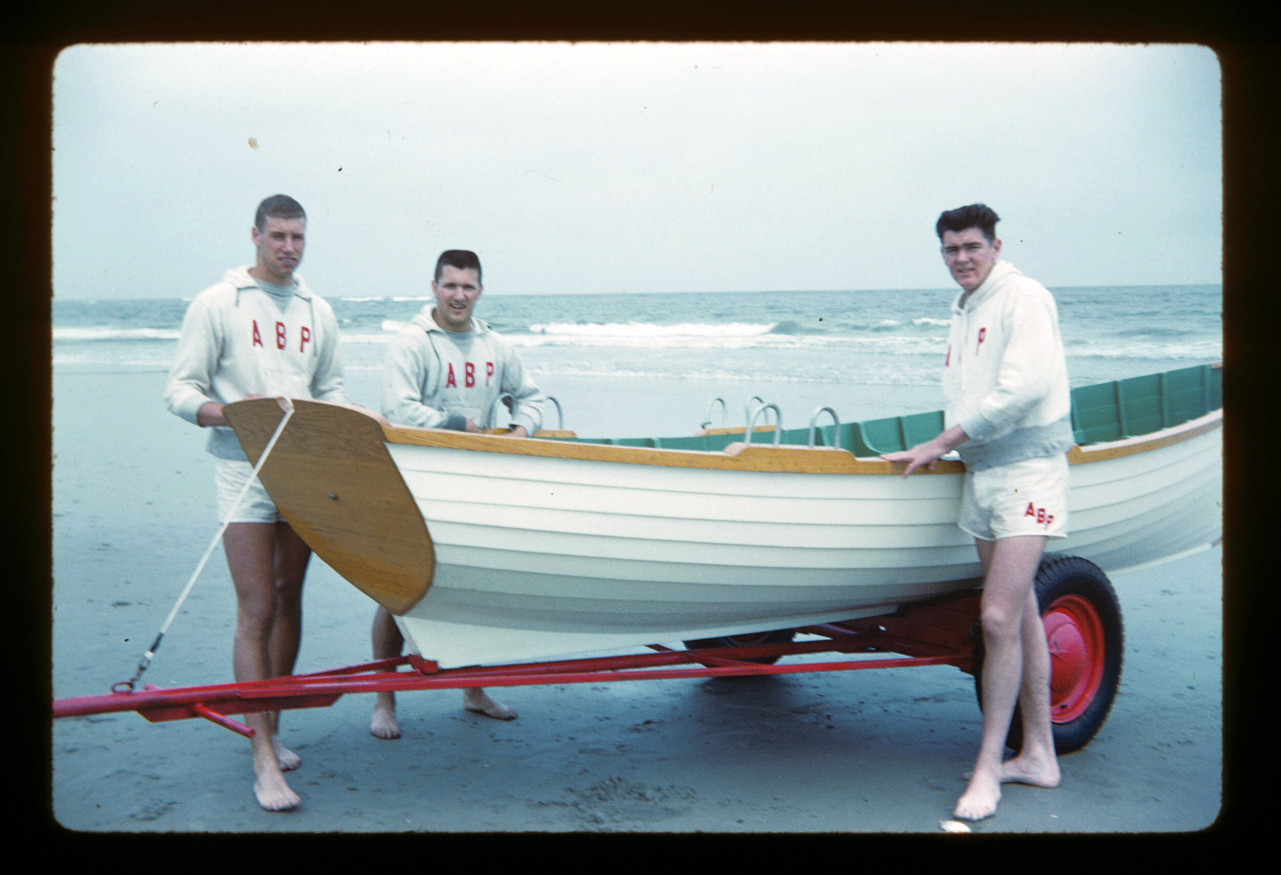 From left, Harvey Knauer, Dave Hillman and Bill Leahy prepare  for the wreath at sea ceremony on Memorial Day weekend 1960.