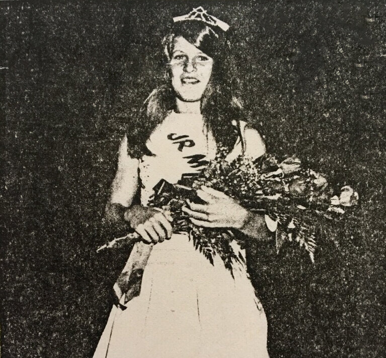 Liz Dougherty poses with her Little Miss Avalon crown and flowers.