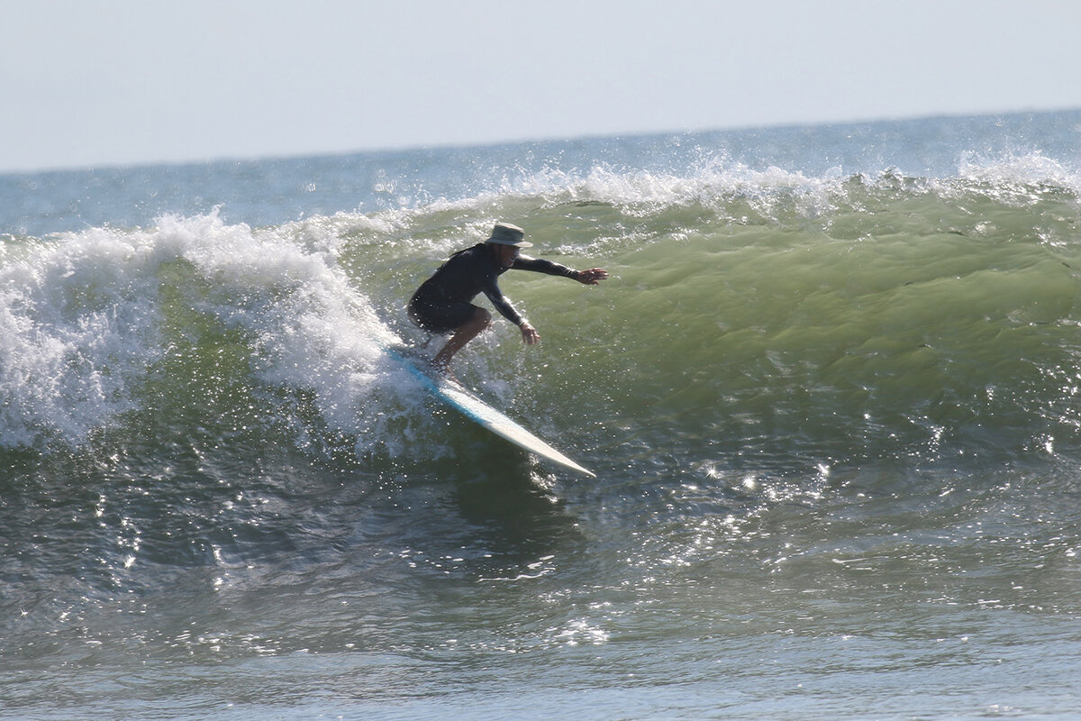 Though Cean Bloss knows his surfing subjects, he can’t easily identify them while he is snapping action shots.