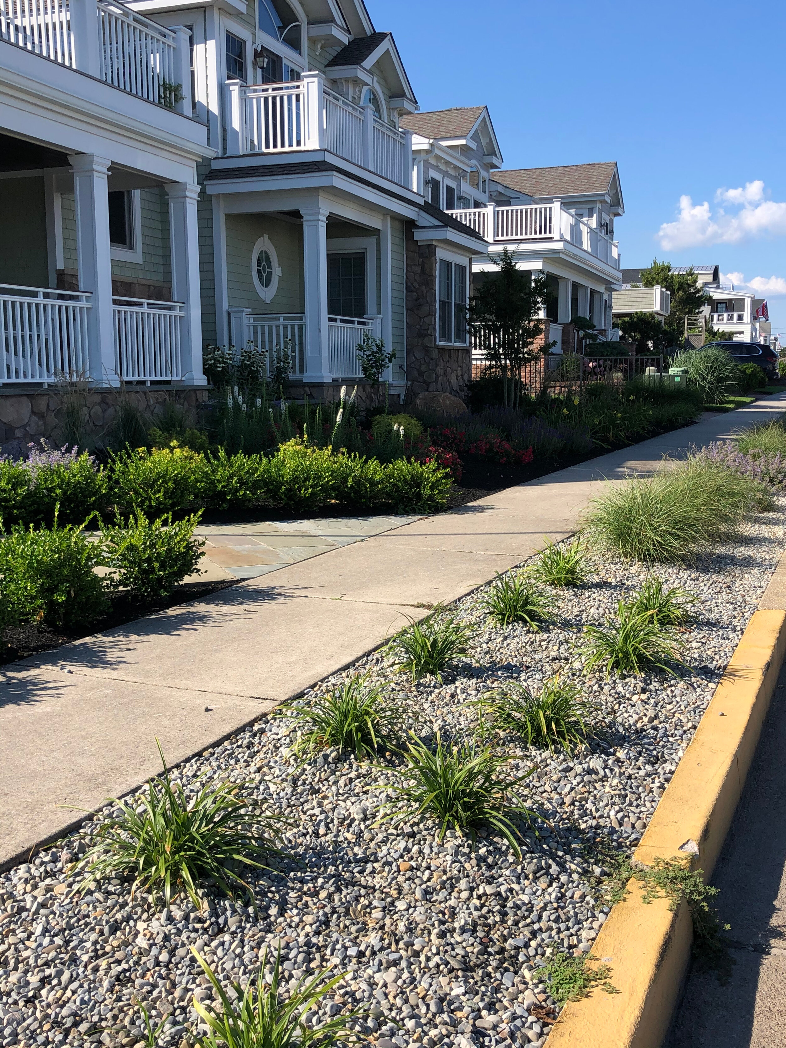 Replacing curbside turf with stones reduces runoff.