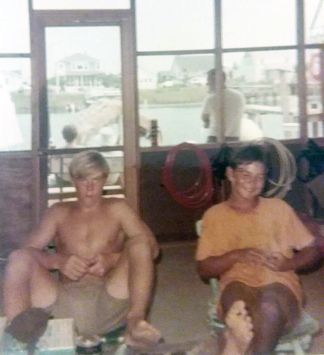 Richard Zinck and Jack Morgan “working” in the boat shop snack bar.