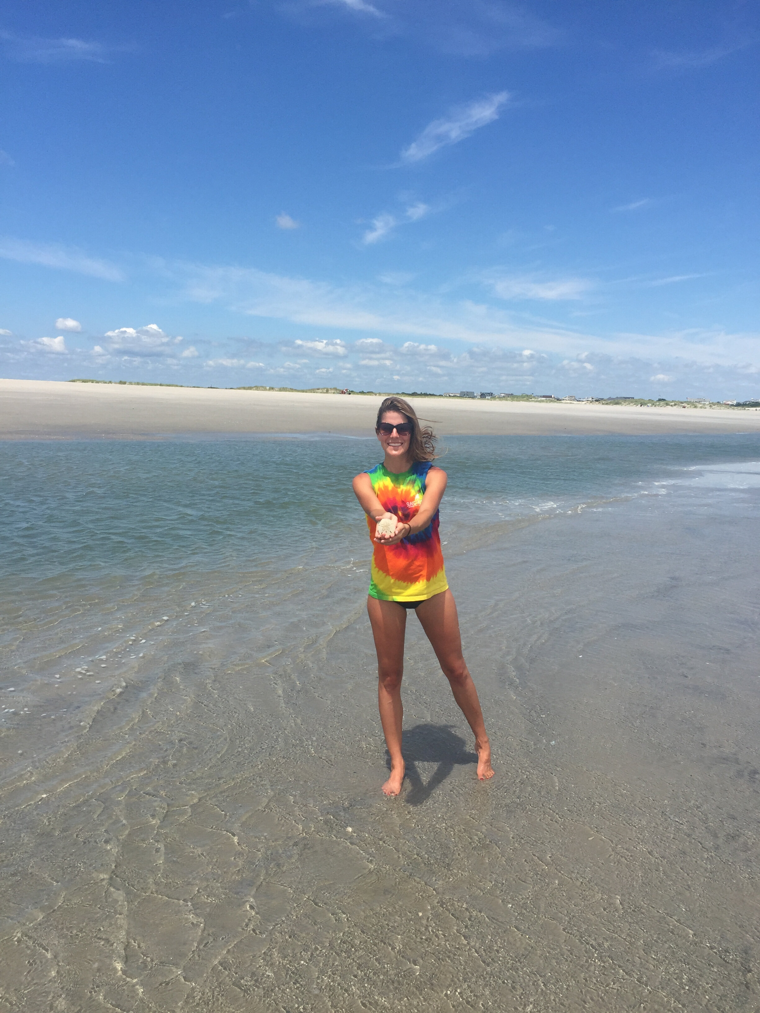 Alison Mastrangelo on “her beach” with Stone Harbor in  the background.