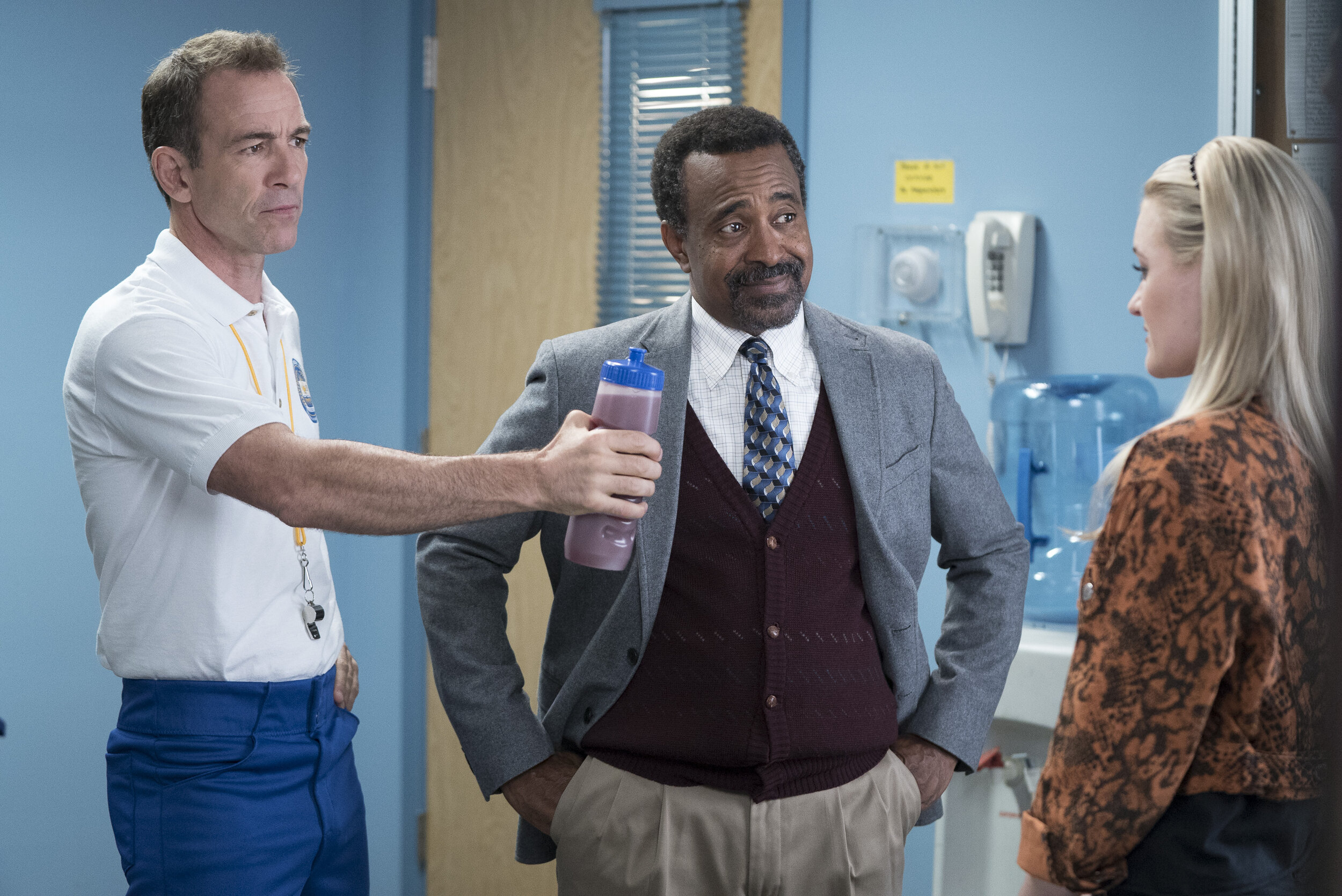 On set of ‘Schooled’ (from left): Bryan Callen as Coach Mellor, Tim Meadows  as Principal Glascott and AJ Michalka as Lainey Lewis.