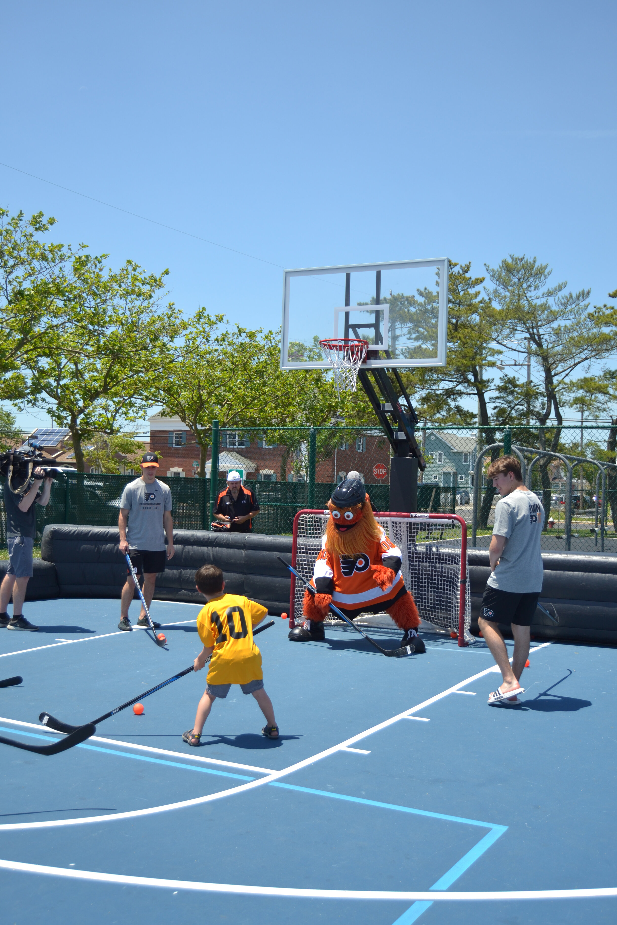 Gritty tests his goalkeeper skills during a one-on-one with a fan. 